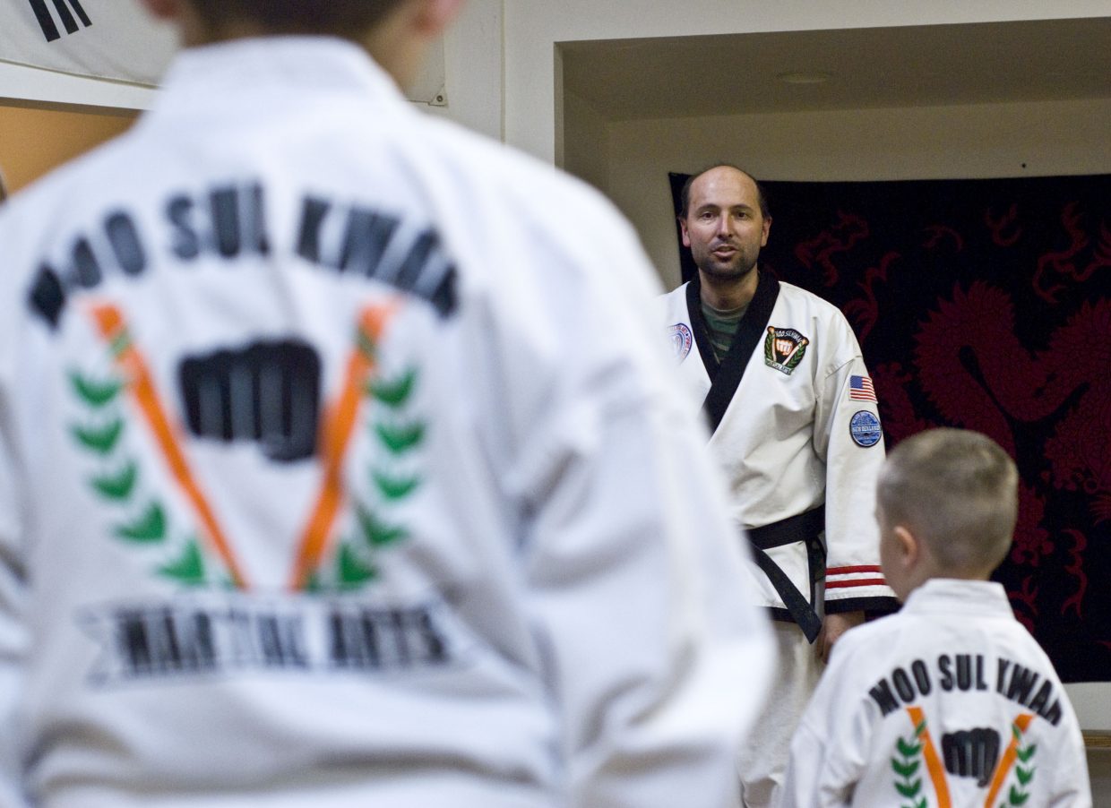 Taekwondo instructor Jason Walker calls attention Wednesday at the beginning of class. Walker teaches four nights a week, beginning at 5 p.m. Monday through Thursday.

