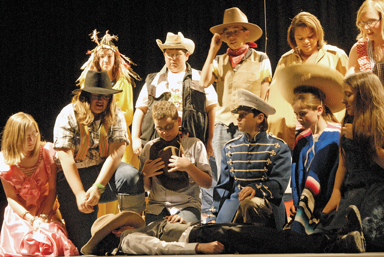 Seventh-grade thespians mourn the apparent loss of King Beast during a performance of “Belinda and the Beast” at the Craig Middle School auditorium Tuesday.