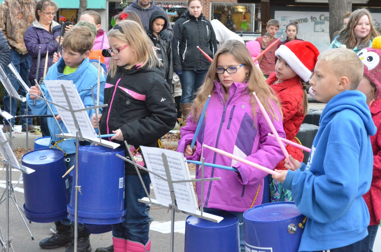 Members of the Sunset Elementary School drum program perform during Down Home Christmas Celebration Saturday at Alice Pleasant Park.