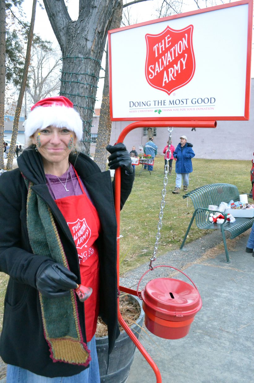 Volunteer LaDeana Cook provides some holiday cheer and raises funds for the Salvation Army during Down Home Christmas Celebration Saturday at Alice Pleasant Park.