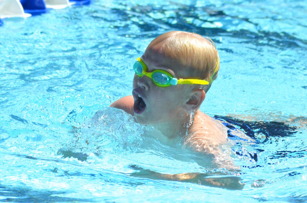 Patrick Neton gets a gulp of air in his lungs as he finishes his leg of the boys 200-meter medley relay at the Craig Sea Sharks' ABC Meet Saturday morning at the Craig City Pool Complex.