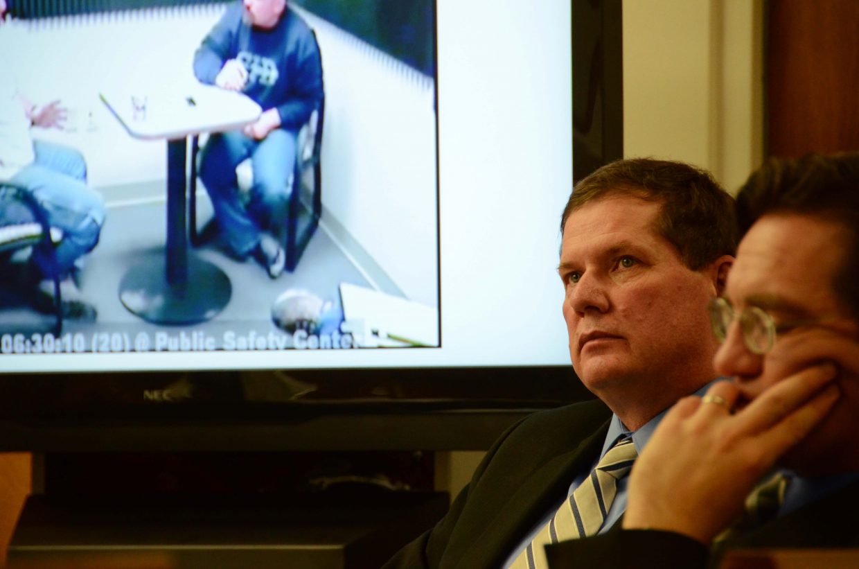 Leroy Fief, background, listens to the prosecution's closing statement while his confession tape is played.