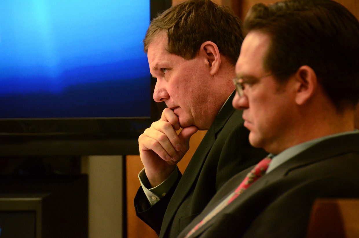 Leroy Fief, background, sits at attention at Moffat County Courthouse with his attorney Jeremy J. Snow, foreground.