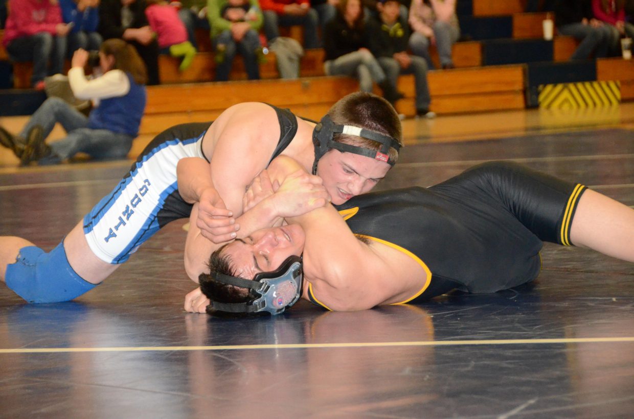 Stelios Peroulis pushes for a pin Tuesday at Moffat County High School. Peroulis and the Bulldogs hosted Meeker in a wrestling dual that the Cowboys won, 54-30. Peroulis got his pin midway through the third period to pick up six points for the Bulldogs.