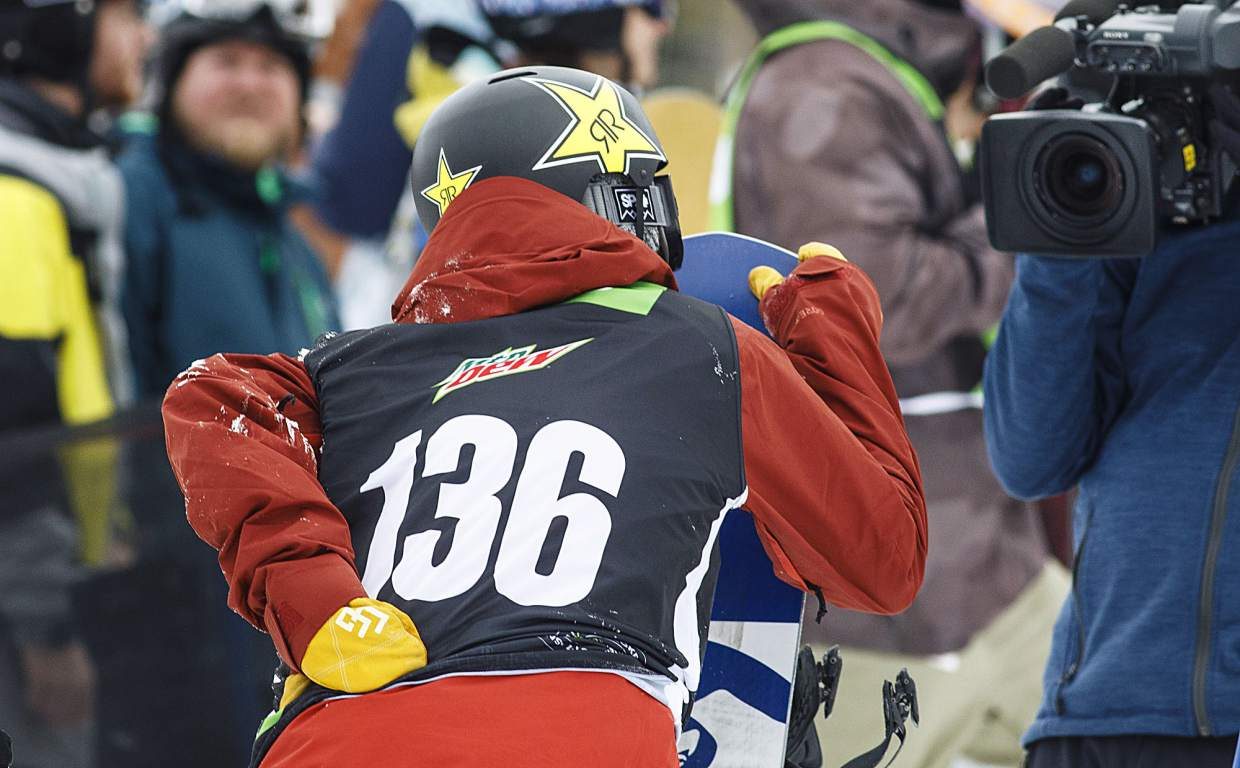 Chris Corning hangs his hand on the back following the last run in the slopestyle finals during the Dew Tour event Saturday, Dec. 16, at Breckenridge Ski Resort. Corning injured his back during the U.S. Grand Prix event at Copper Mountain last week.