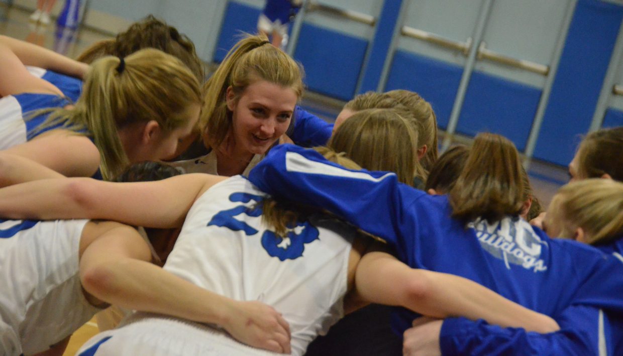 Moffat County High School girls basketball players huddle up and get their energy gathered during pre-game warmups.