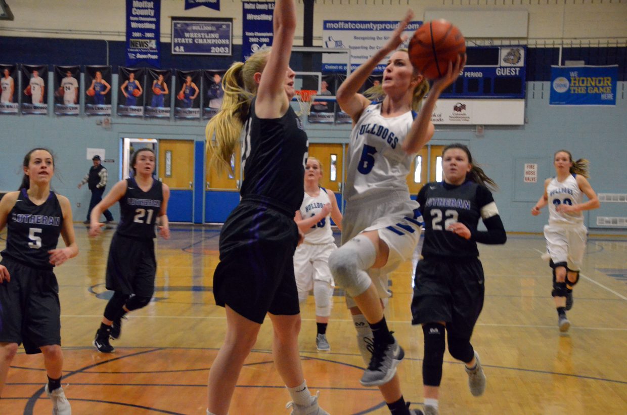 Moffat County High School's Kinlie Brennise goes in for the layup against Lutheran.