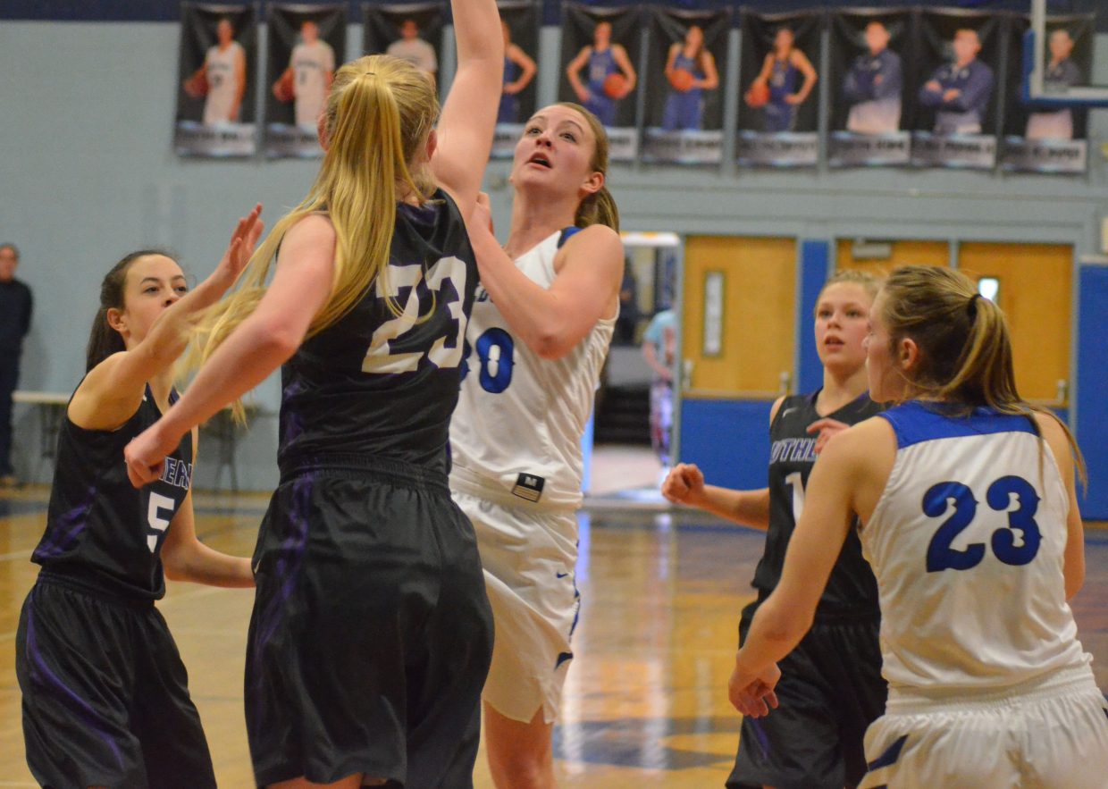 Moffat County High School's Jana Camilletti leans in against Lutheran's Haley Shaklee to draw a foul.