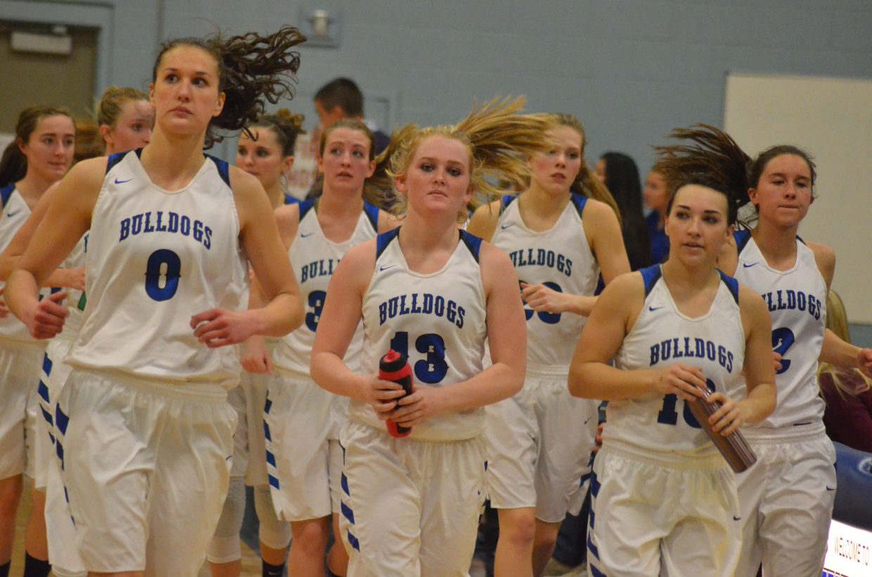 Moffat County High School basketball players head back onto the court after halftime against Lutheran. MCHS girls will leave Wednesday for the state tournament Thursday through Saturday.