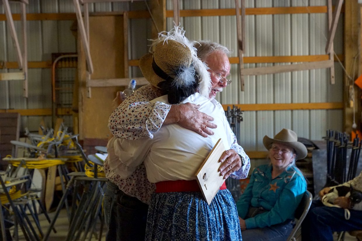 Sargent Sagebrush Burns doles out awards and hugs for the lady shooters. 