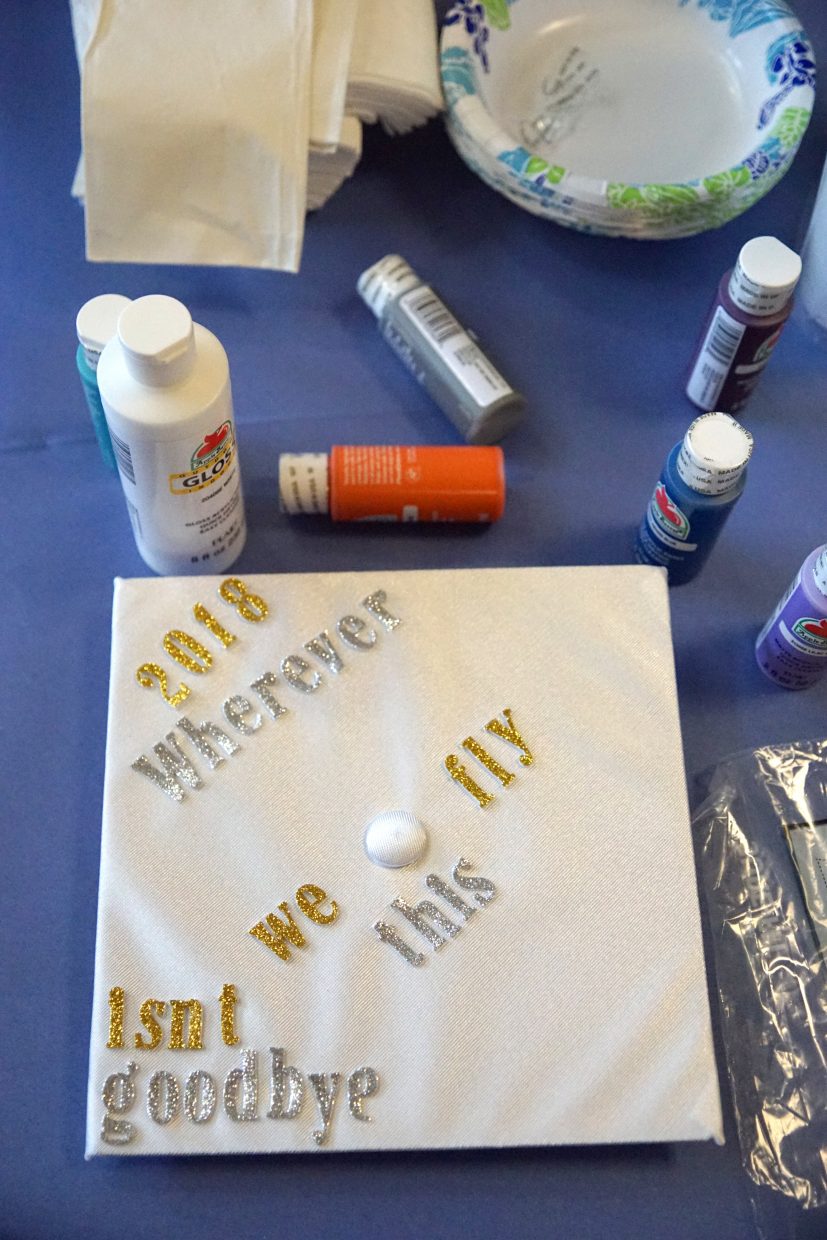 Paint, glitter, glue and decals were in demand by cap decorating seniors. 