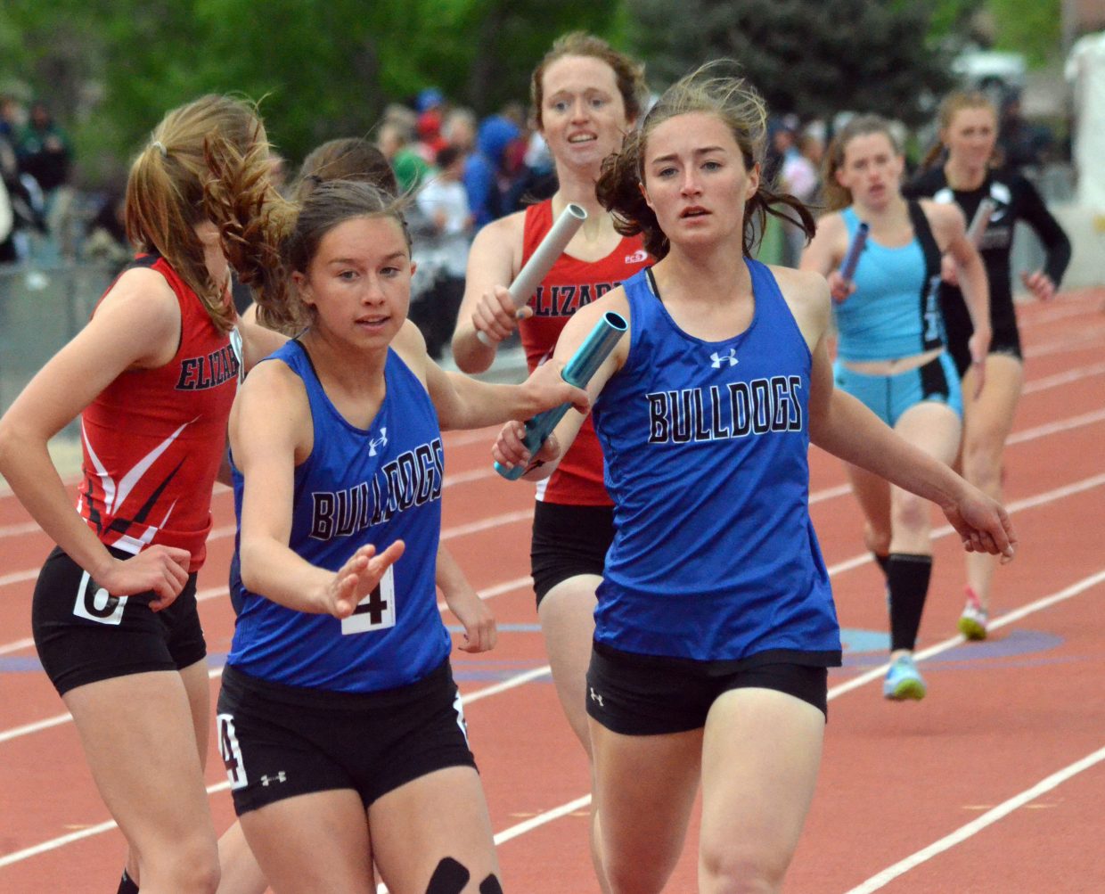 Moffat County High School's Emaleigh Papierski, left, grabs the baton from Josie Timmer for the final lap of the 4x400-meter relay Saturday at the CHSAA State Championships.