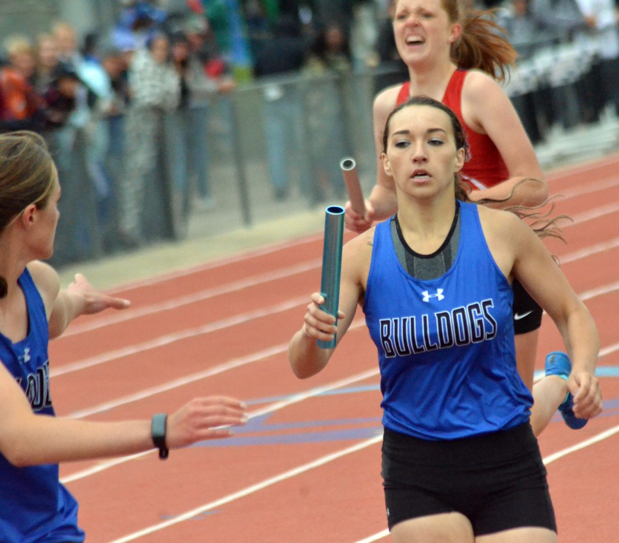 Moffat County High School's Quinn Pinnt reaches forward for the handoff in the 4x400-meter relay Saturday at the CHSAA State Championships.