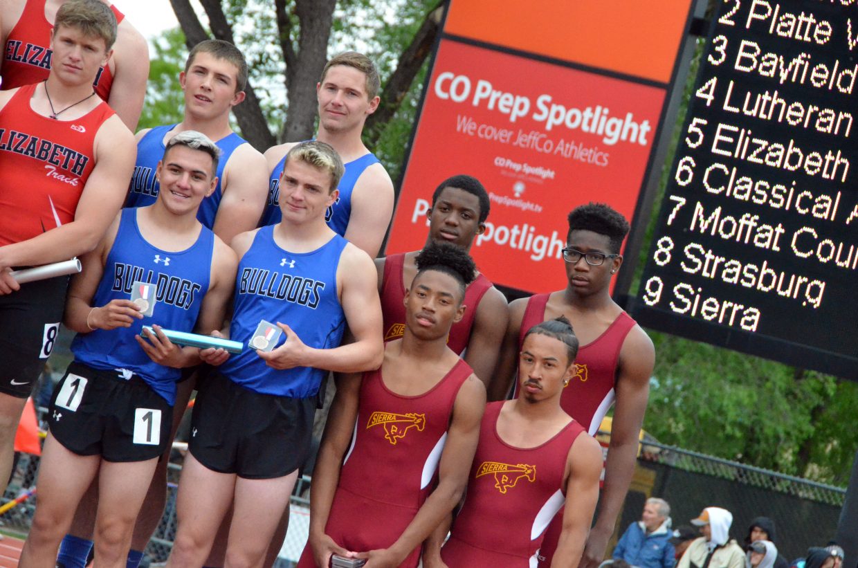 Clockwise from top left, Moffat County High School's Elias Peroulis, Miki Klimper, Jared Atkin and Victor Silva display seventh-place medals for the 4x100-meter relay Saturday at the CHSAA State Championships.