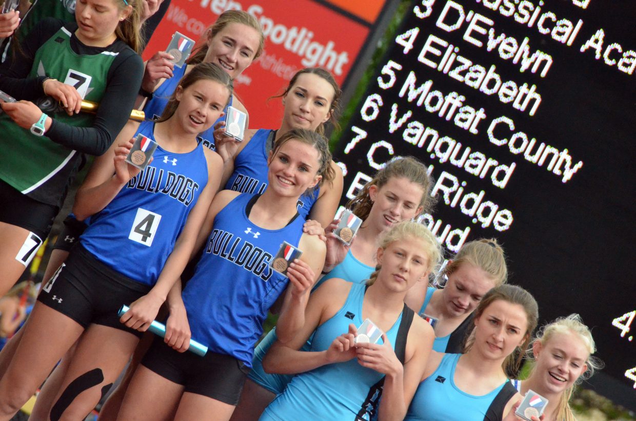 Clockwise from top left, Moffat County High School's Josie Timmer, Quinn Pinnt, Stephenie Swindler and Emaleigh Papierski display fifth-place medals for the 4x400-meter relay Saturday at the CHSAA State Championships.