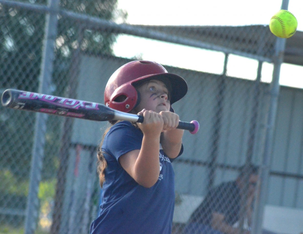 Craig Family Dental's Kennedy Kostur swings at a high pitch.