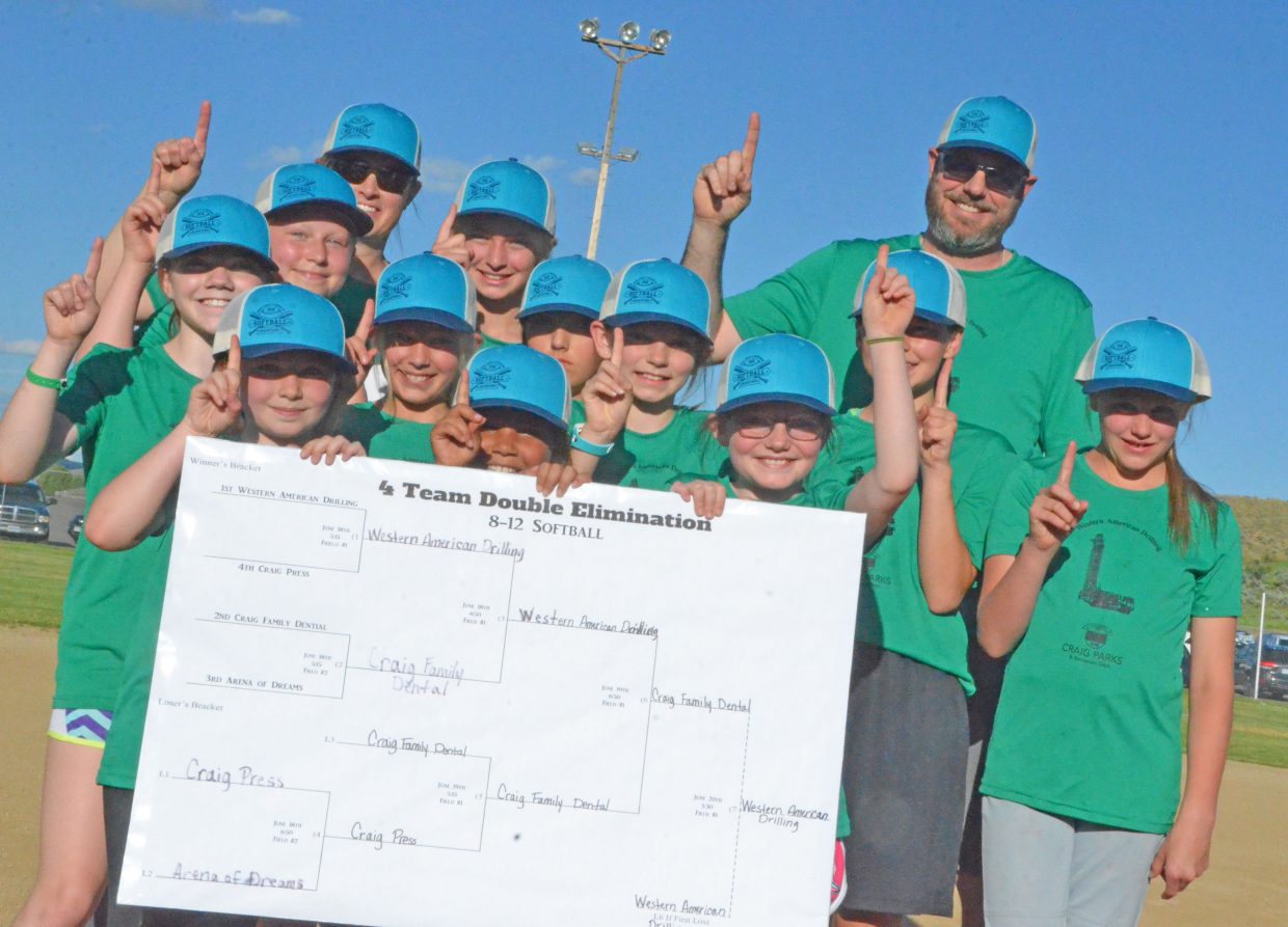 The players and coaches of Western American Drilling flash the No. 1 sign as the champions for the Craig Parks and Recreation 8- to 12-year-old softball league Wednesday at Loudy-Simpson Park. The team defeated Craig Family Dental 12-7 for the title.