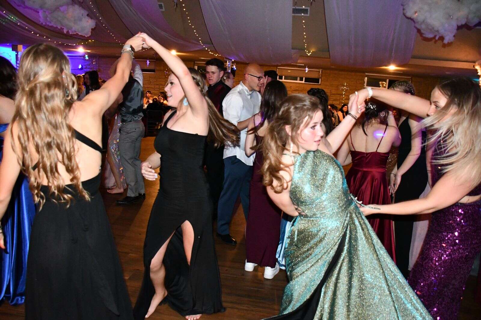 A group of girls shares a dance Saturday night. (Andy Bockelman / For Craig Press)