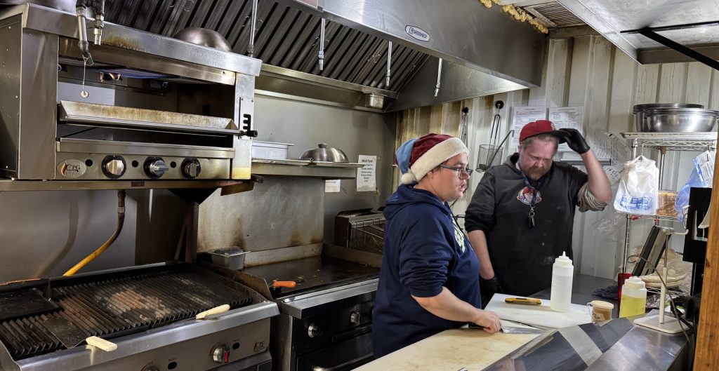 Pasta Delight owner Sasha Otero, left, stands alongside Nick Lighthizer in one of The Warehouse’s kitchens on Dec. 21. The food hall closed its doors after several years of operation. Otero is now on the hunt for another location to continue her business.