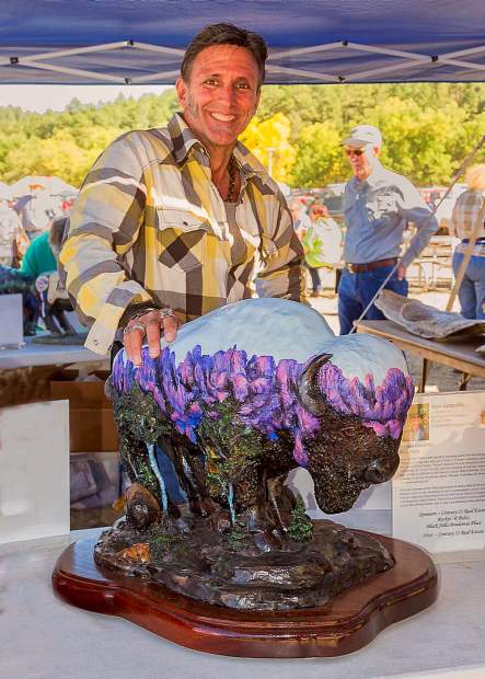 The film crew of Richard Weis' Born to Explore has a good eye for distinctive art as they interview Lampshire during the ABC coverage of the 2012 Custer Buffalo Roundup and Arts Festival.