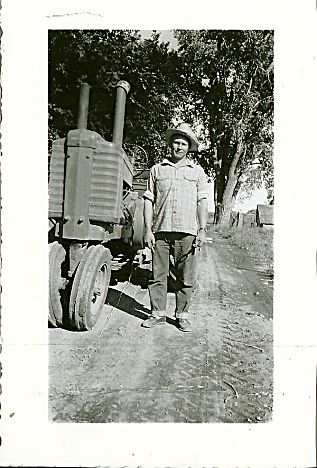 Charles âChuckâ Nelson works on the Nelson family farm east of Longmont, Colo., circa 1952.
