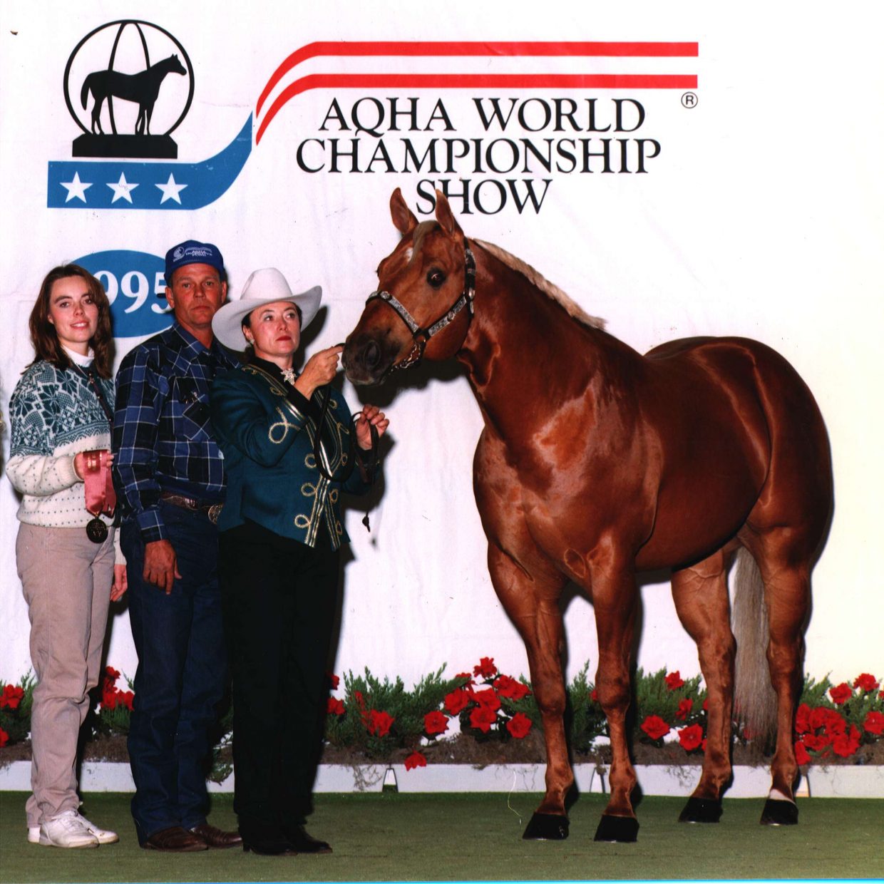 Sutton’s Solid Gold Edition was a ranch stallion who achieved fourth in the nation in 1995 aged stallions. Pictured here are Heather, Ray, and Georga at the AQHA World Show