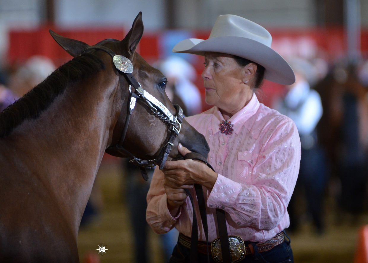 Georga Sutton and RWS Cocoa D Or Badger, the high point open yearling filly in the South Da-kota Quarter Horse Association in 2014.
