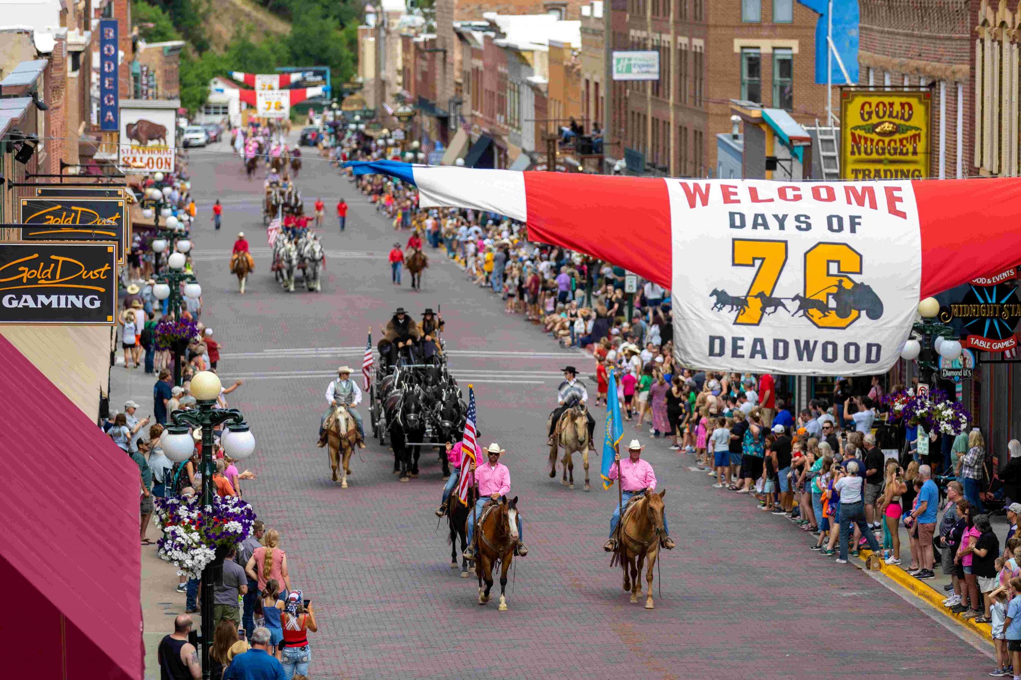 Hit Parade Days of ’76 Rodeo Parade full of wagons, pieces of American