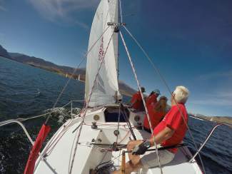 A taste of high-siding on a J22 sailboat while sailing on Lake Dillon, one of the toughest bodies of sailing water in the state.