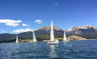 Sailboats make crisscross paths on Lake Dillon with Buffalo Mountain and Red Peak in the background. Many sailors consider Summit County's largest body of water one of the most picturesque reservoirs in the nation.