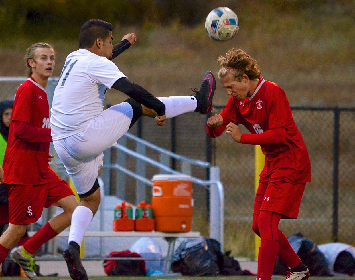 Summit senior forward Salvador Zambrano jumps for the ball as a Steamboat Springs defender moves in for a header during a home varsity soccer game on Sept. 22. The Tigers won, 4-2.