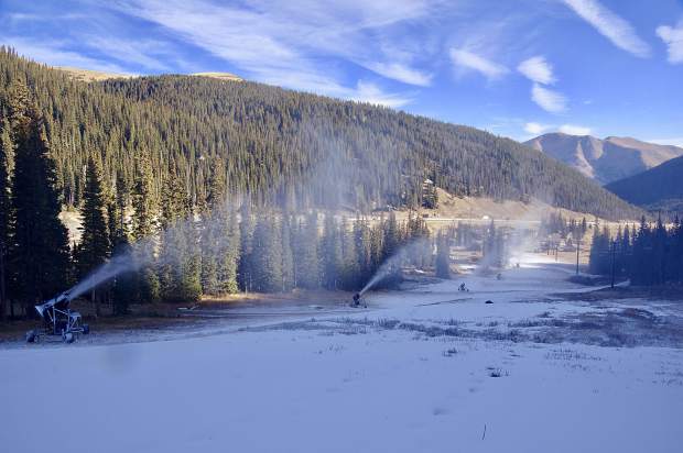 Snow guns at Loveland Ski Area blow on the lower face of Home Run for the first time in two weeks early on the morning of Nov. 1. Due to above-average temperatures across the state, Loveland, Keystone and Wolf Creek have delayed their opening days.