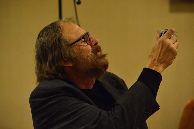 Kirby McClure snaps photos at the 28th Tim McClure Benefit on Friday, March 10, at the DoubleTree in Breckenridge.