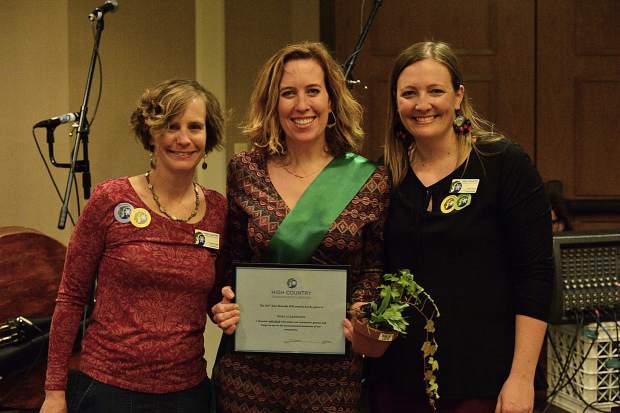 Nora Gilbertson, center, accepts a Green Scene award at the 28th Tim McClure Benefit on Friday, March 10, at the DoubleTree in Breckenridge.