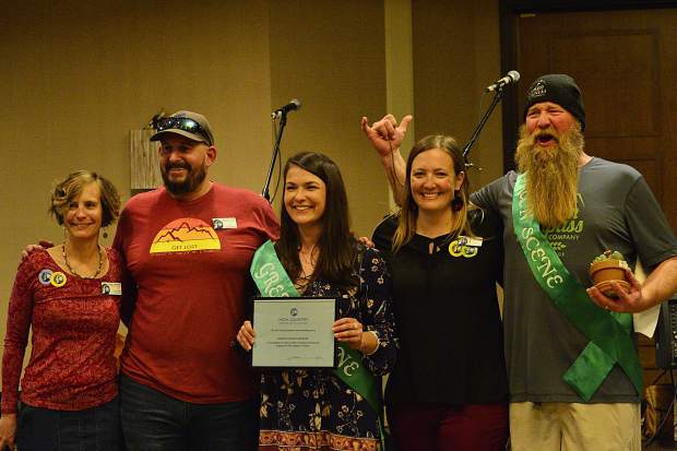 Broken Compass Brewing accepts a Green Scene award at the 28th Tim McClure Benefit on Friday, March 10, at the DoubleTree in Breckenridge.