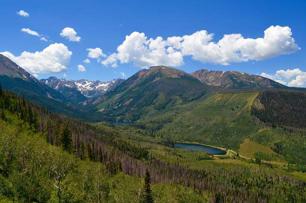 From a high hillside along the Gore Range Trail looking down into Black Lake and Black Lake Reservoir with Dora Mountain and its neighboring peaks framing the bodies of water.