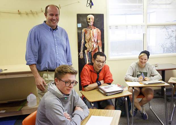 Travis Aldrich, The Peak Schoolâs new head of school, shares a laugh with students on Wednesday, Sept. 13, in Frisco.