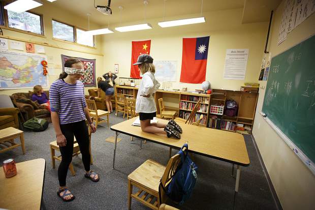 Students at The Peak School in Frisco participate in a blindfold challenge during a class session on Wednesday, Sept. 13, in Frisco.