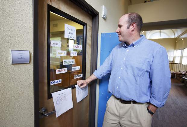 Travis Aldrich, The Peak Schoolâs new head of school, looks in on a classroom from the hallway on Wednesday, Sept. 13, in Frisco. The 41-year-old private education veteran eyes enrollment expansion for the independent program beyond its current 70 students.