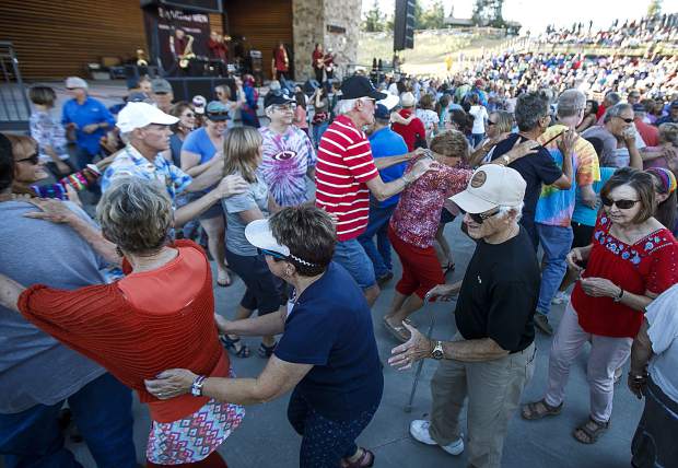Fans collaborate in a conga line during the Dillon Concert Series Friday evening, June 29, at the Dillon Amphitheater.