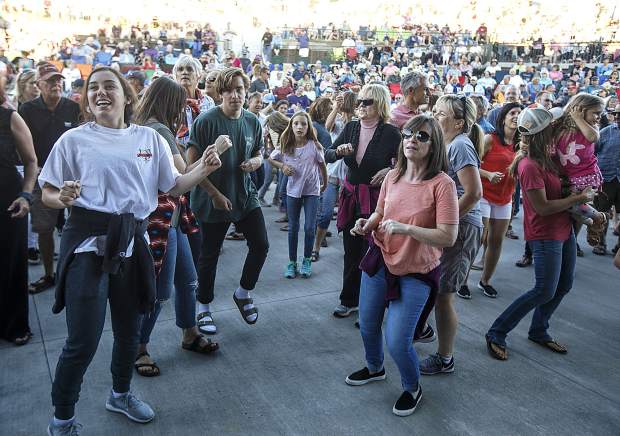Fans dance in tune with The Nacho Men band during the Dillon Concert Series Friday evening, June 29, at the Dillon Amphitheater.