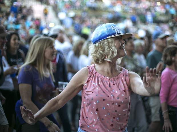 A fan dances in tune with The Nacho Men band during the Dillon Concert Series Friday evening, June 29, at the Dillon Amphitheater.