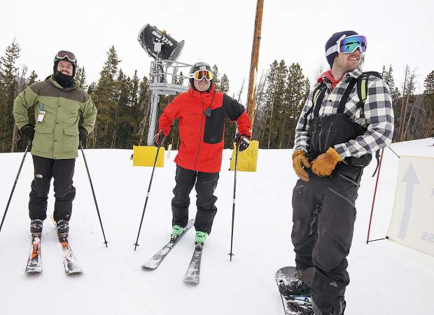 Chad Althusser, a retired Major of the US Marine Corp, from left, Jon Lujan, a retired Sergeant, and Josh Jespersen, a Navy SEAL, watch colleagues ski down a slope Wednesday, Feb. 13, at Keystone Resort.