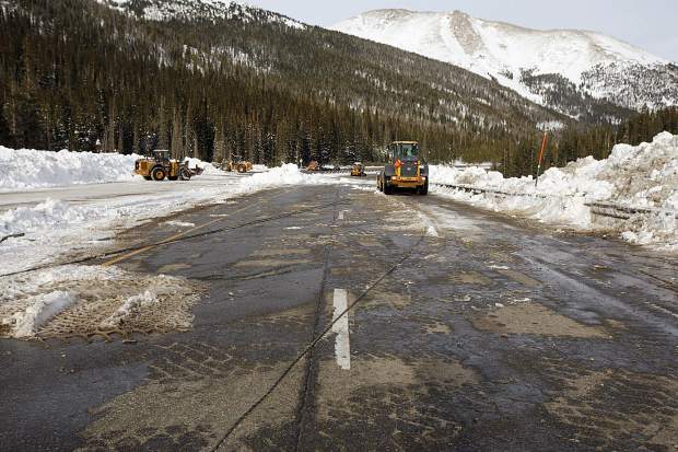 Helicopter-dropped explosives trigger planned avalanches that shut