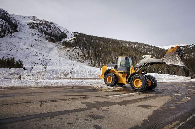 Helicopter-dropped explosives trigger planned avalanches that shut