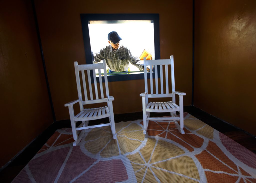 Walter Briney, board president of the local Habitat for Humanity, takes measurements of a playhouse Thursday, June 27, ahead of the public exhibit in Dillon. The Playhouse Project will be on display for six weeks before each house is sold to the highest bidder. The proceeds will go to the Family and Intercultural Resource Center's affordable housing program.