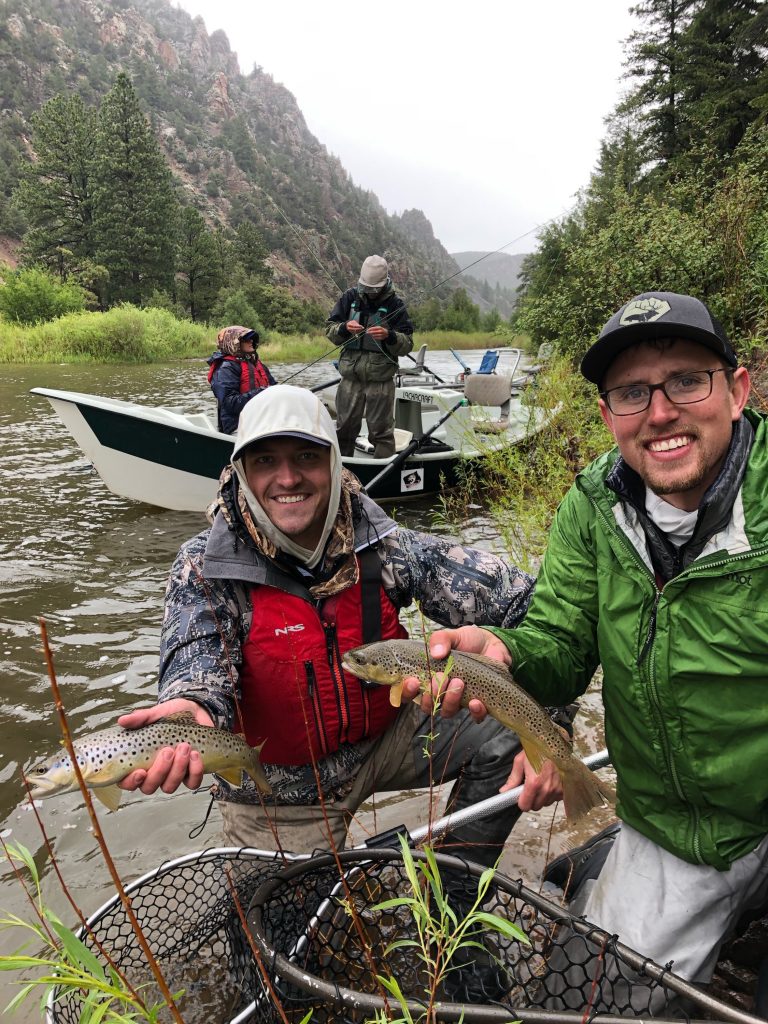 Anglers guided by Cutthroat Anglers hold up their catches.