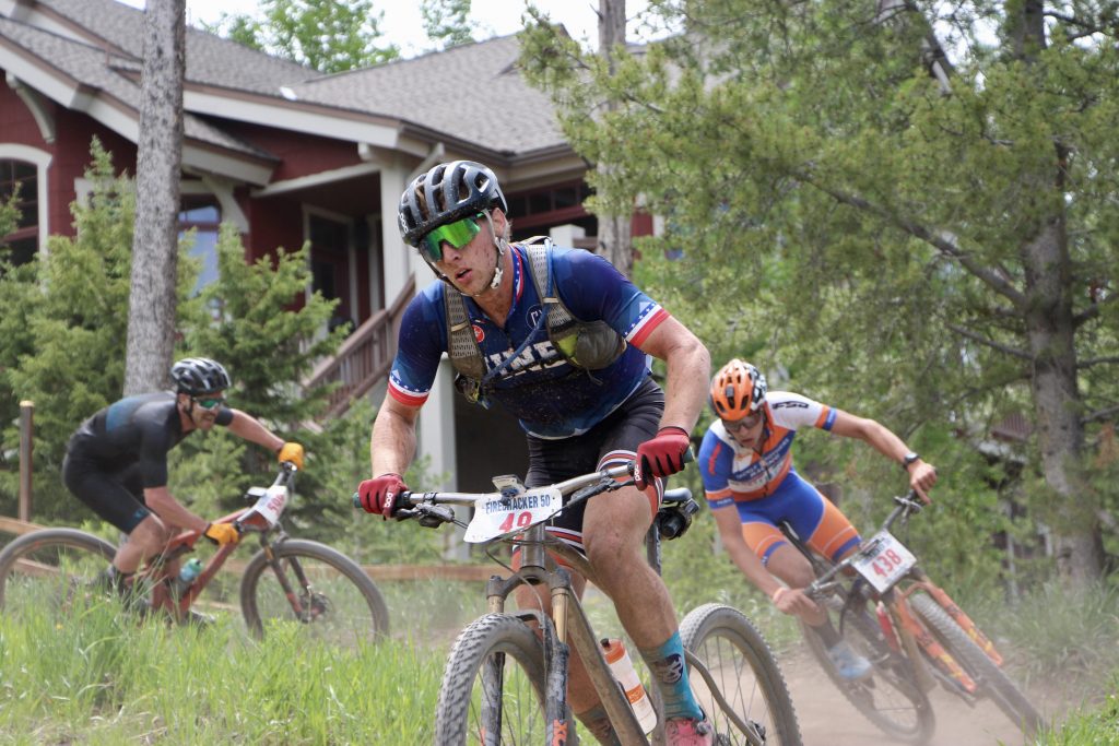 Dan McMahon rides his mountain bike with several competitors hot on his heels during Thursday's Firecracker 50 mountain bike race in Breckenridge.