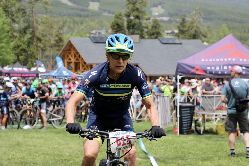 A member of the Asleson-Matheny Team 101 Duo Relay rides during Thursday's Firecracker 50 mountain bike event in Breckenridge.