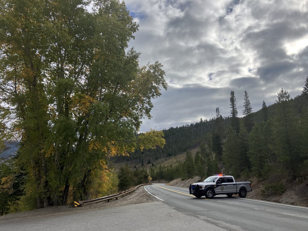 Driver charged for not reporting crash after rolling over guardrail on